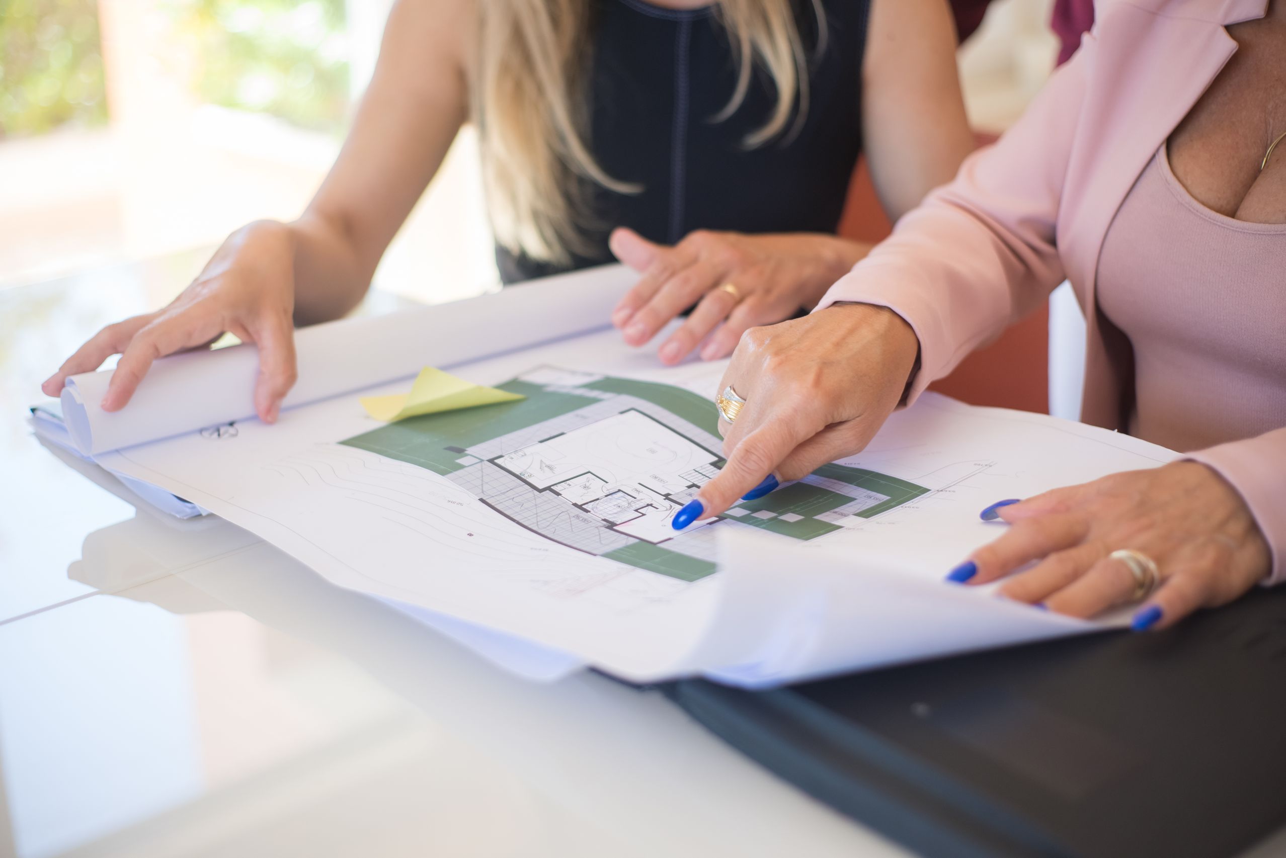 Two people reviewing plans